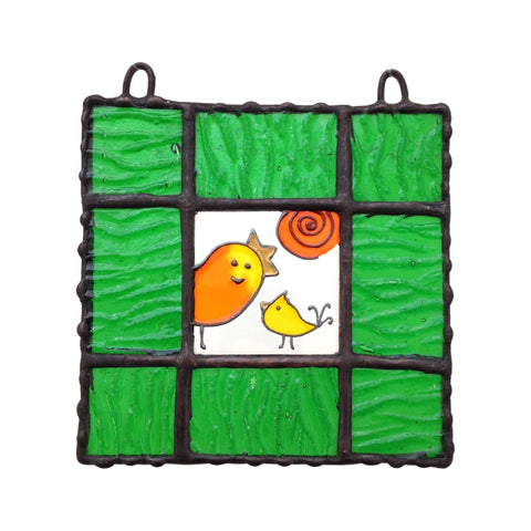 LeKoky Hand-painted BIRDS LOVE Glass Suncatcher with mama and baby bird design framed in green glass. Created by Lenka in Southampton, UK. Perfect for bright spaces and windows. Ideal gift for any occasion. Size: 10cm x 10cm, weight: 110g.