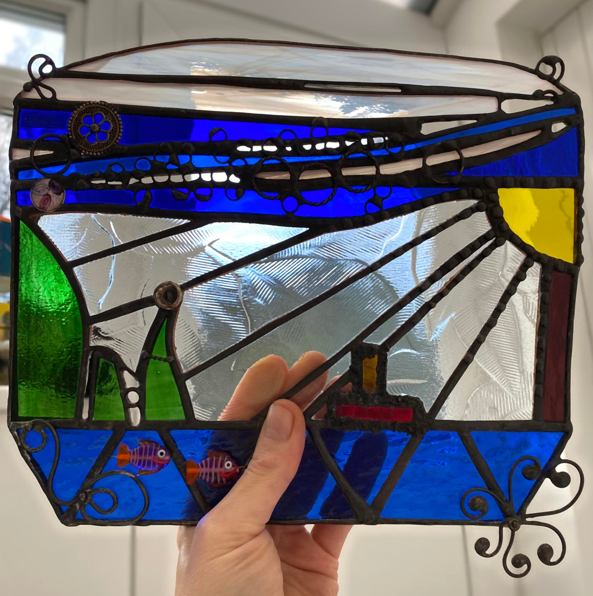 LeKoky Suncatchers Handheld stained glass suncatcher showcasing its size and delicate details.