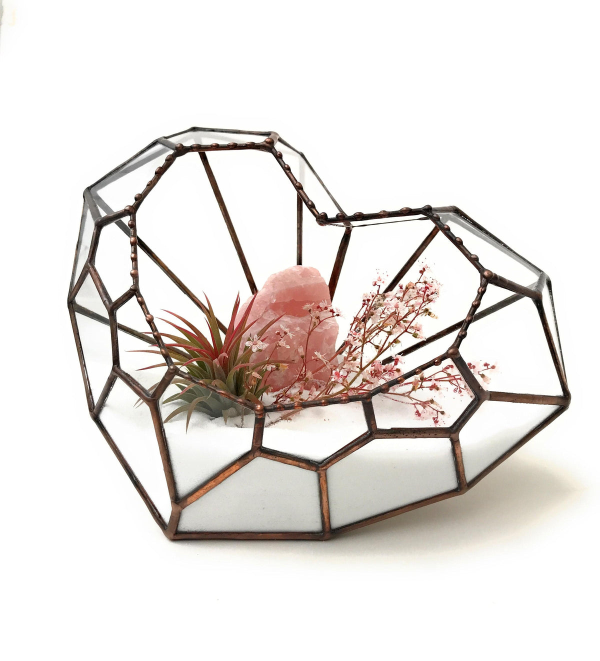 LOVE HEART Geometric Glass Terrarium with a rustic copper finish, featuring vibrant succulents and moss for a modern indoor display.
